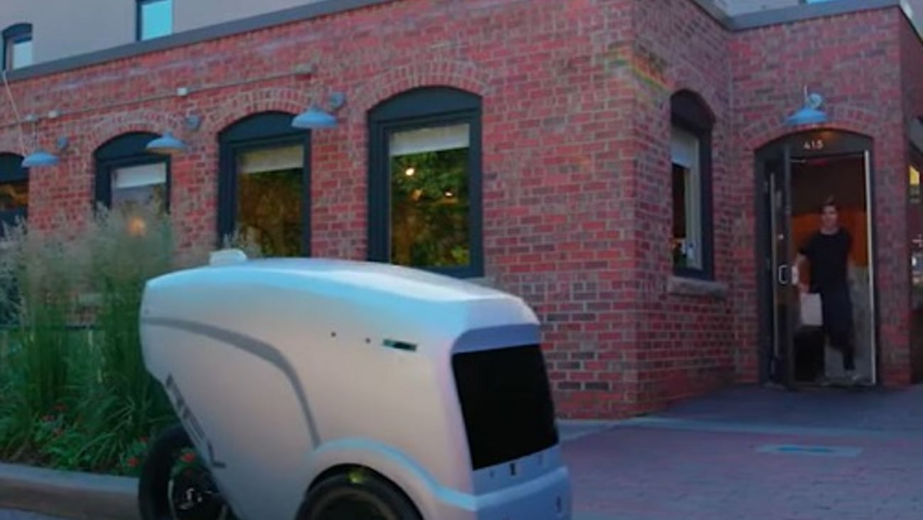 a car parked in front of a brick building