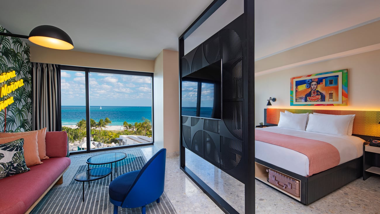 a bedroom with a large bed in a hotel room