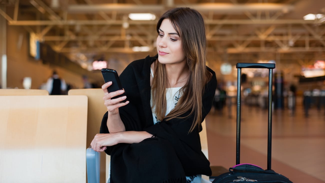 a woman holding a piece of luggage