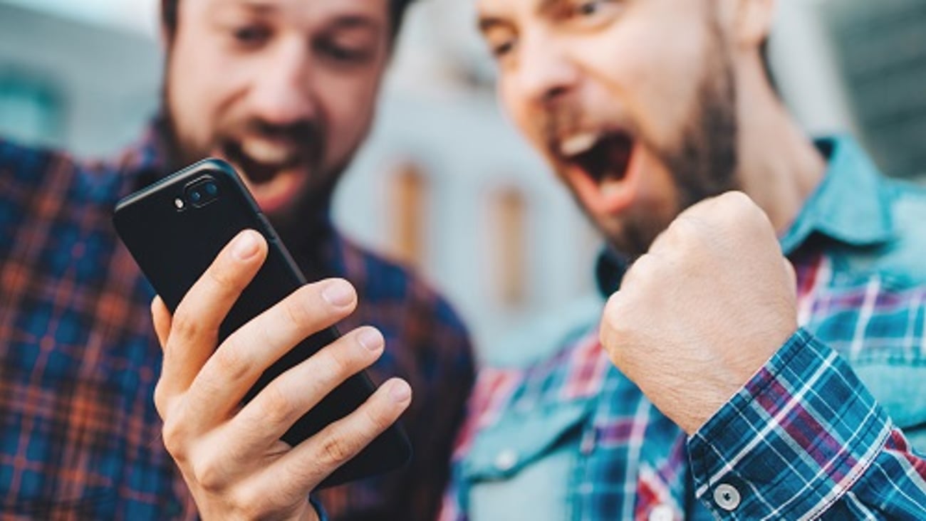 a close up of a person holding a phone