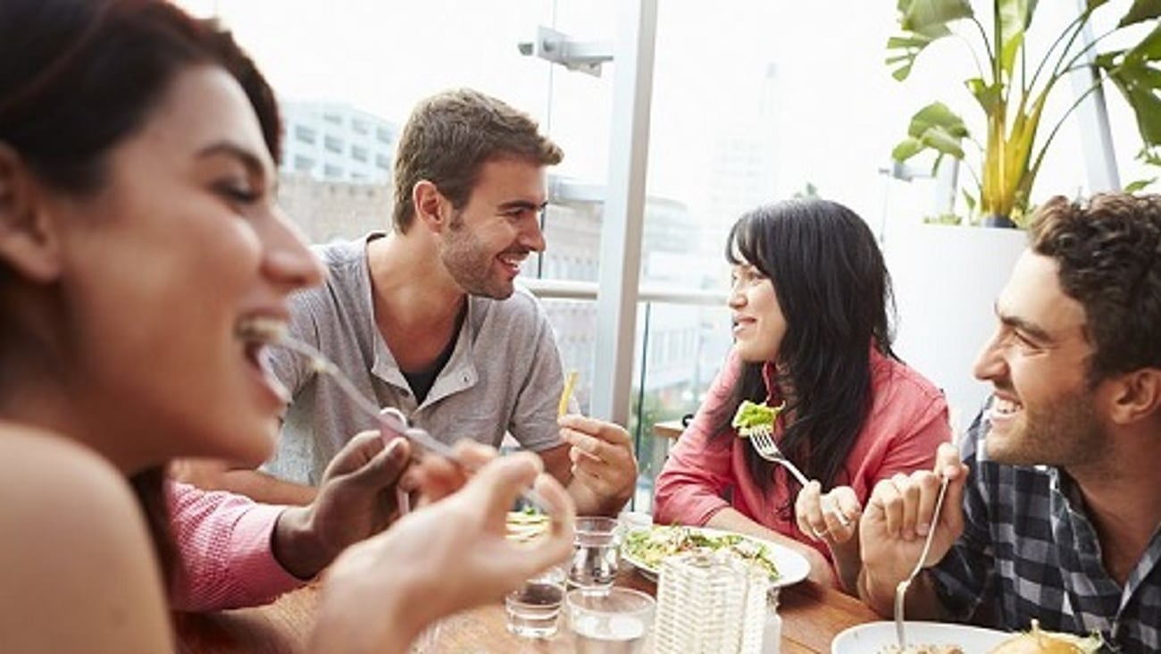 a group of people sitting at a table