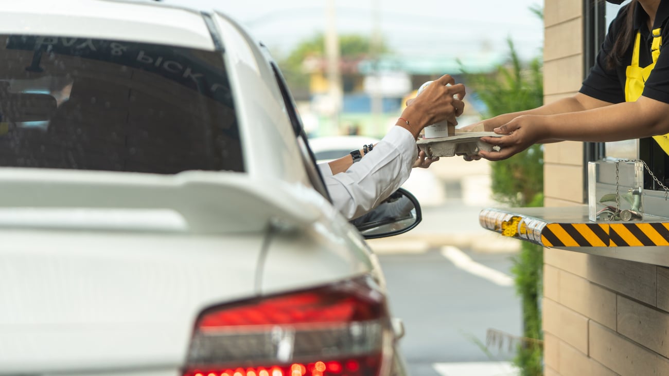 a person riding on the back of a car