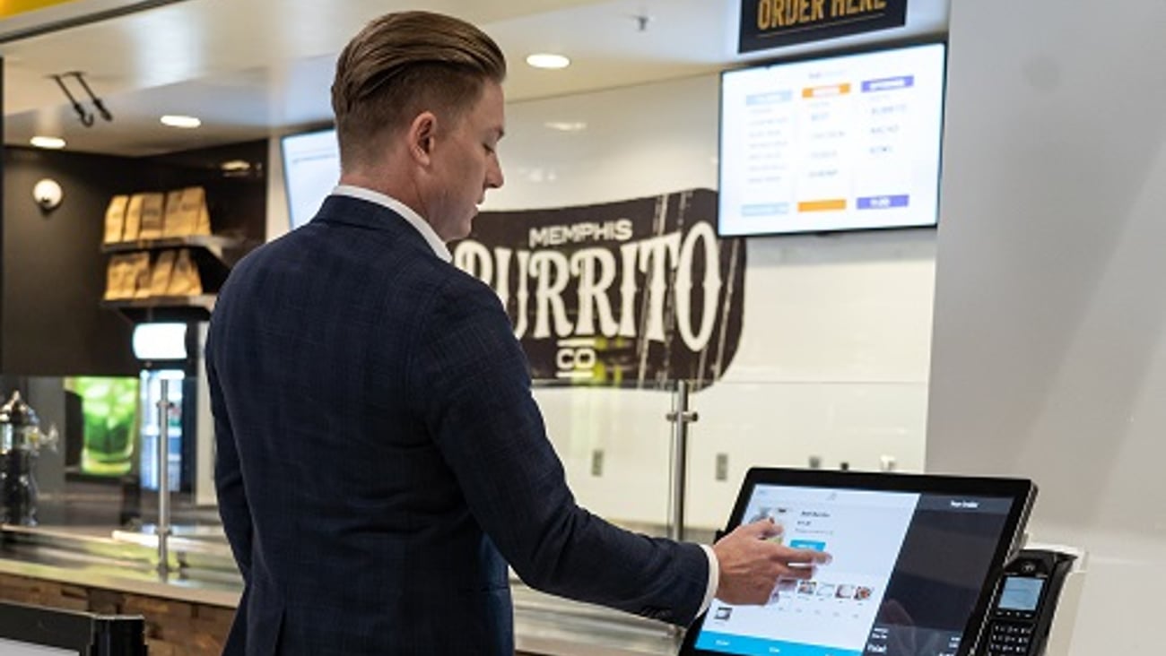 a person standing in front of a computer