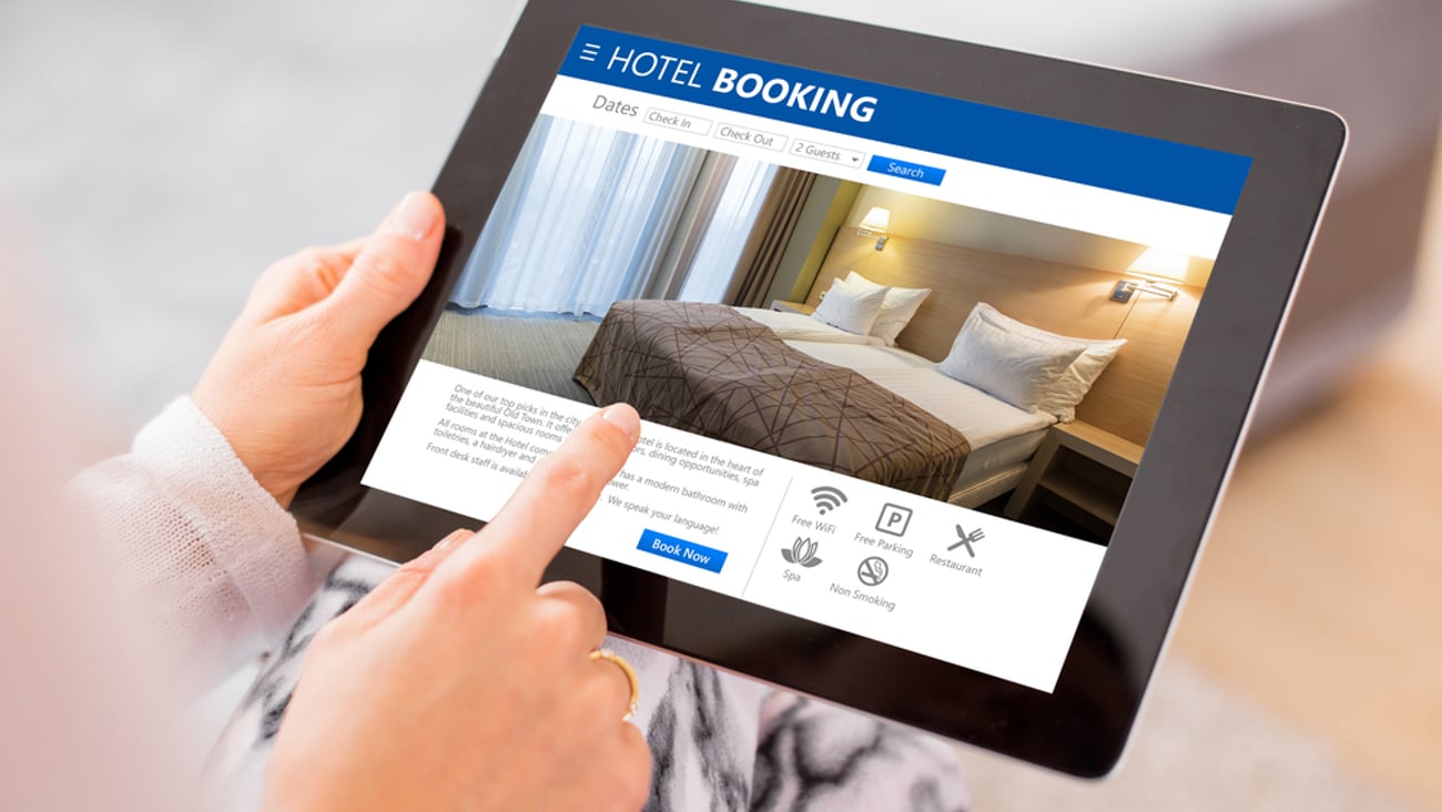 Person booking a hotel room via their tablet