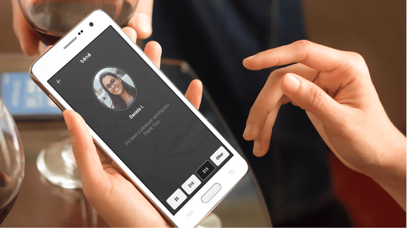 person giving a tip to a hotel employee via digital app