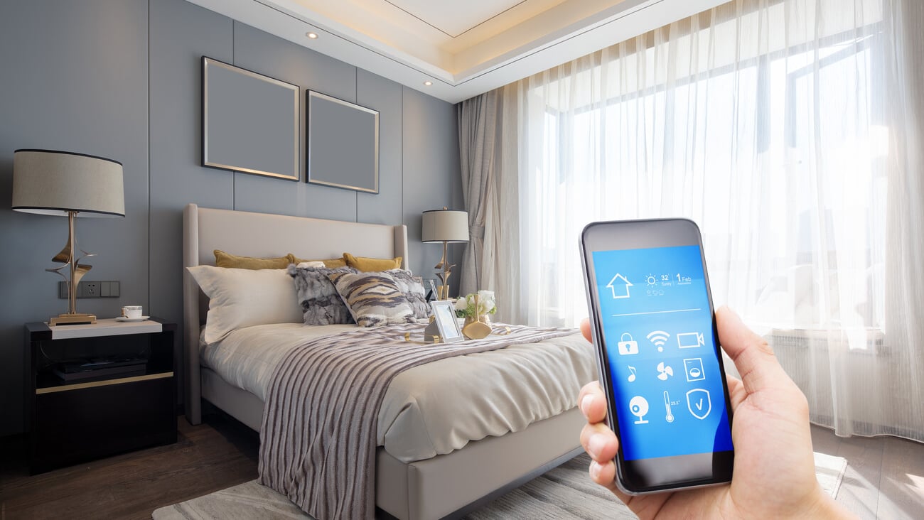 smart home system on mobile phone with background of modern ; Shutterstock ID 1034286610
