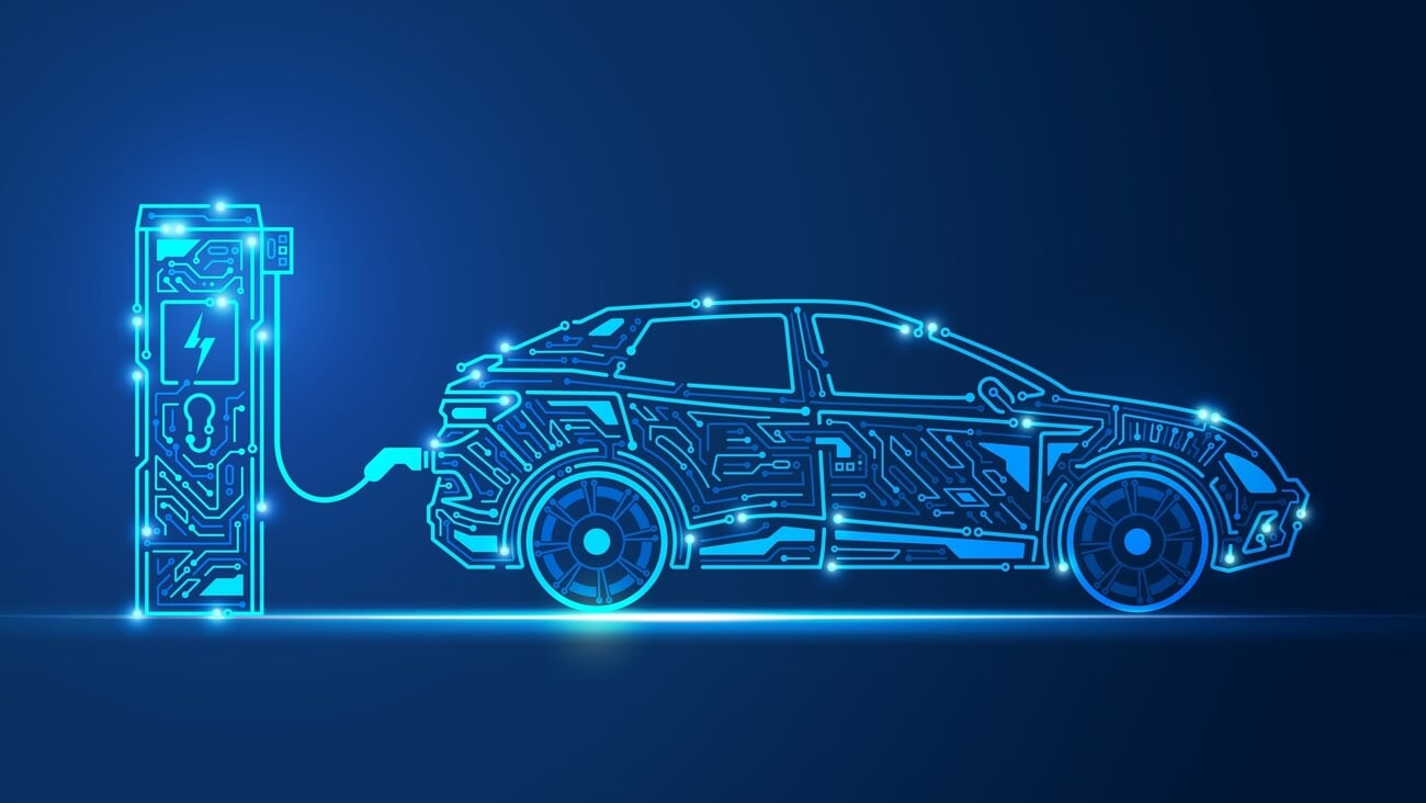 graphic of EV charger station and electric vehicle combined with electronic pattern; Shutterstock ID 2226578201