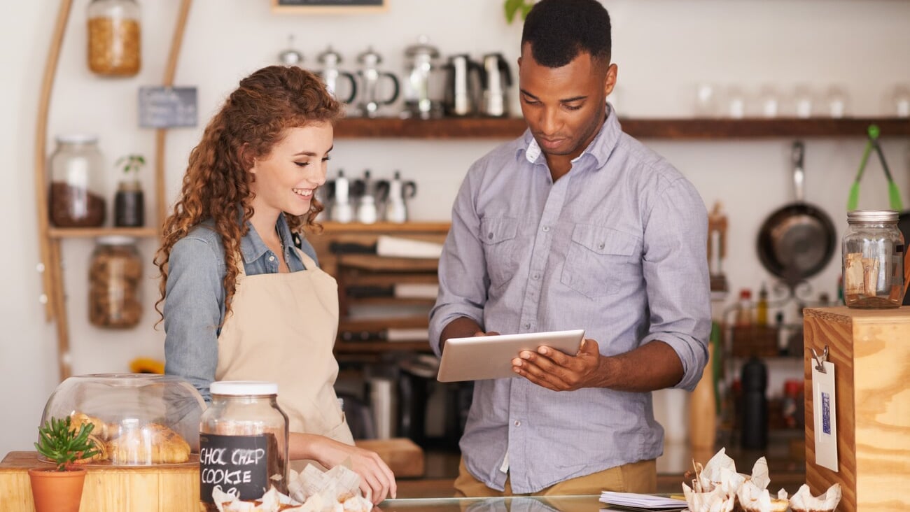 The coolest cafe in town. Shot of two people in a cafe.; Shutterstock ID 2166951183