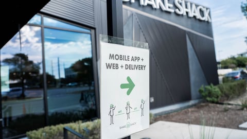 a sign in front of a building