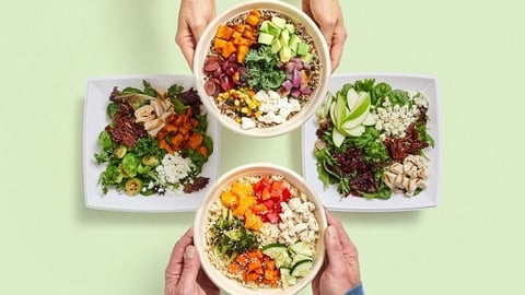 a man holding a plate of food