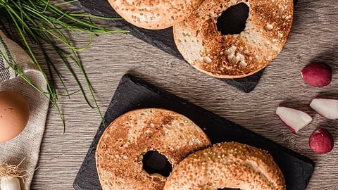 a doughnut sitting on top of a wooden table