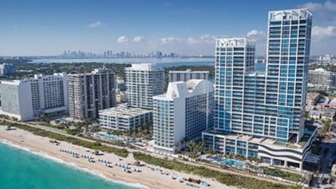 a beach with a city in the background