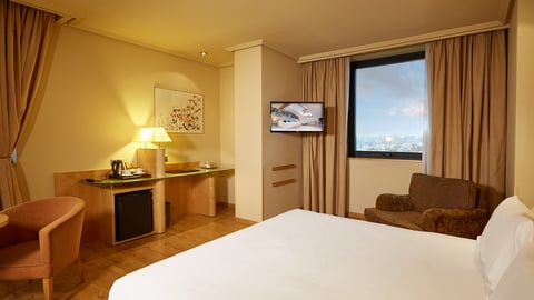 a view of a living room filled with furniture and a flat screen tv