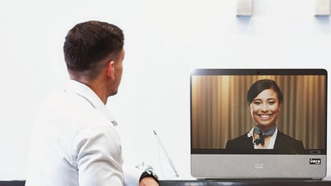 a man standing in front of a television