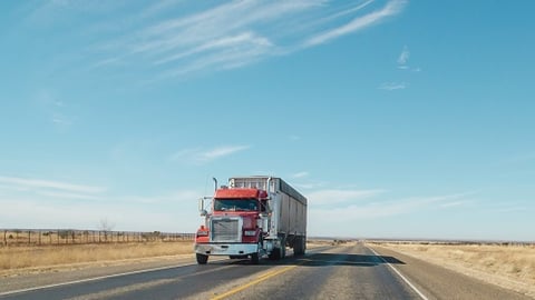 a truck that is driving down the road