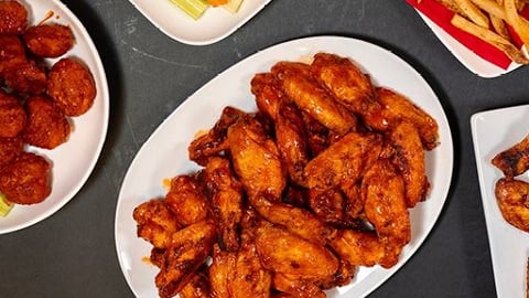 a bunch of Wing Boss wings sitting on a plate