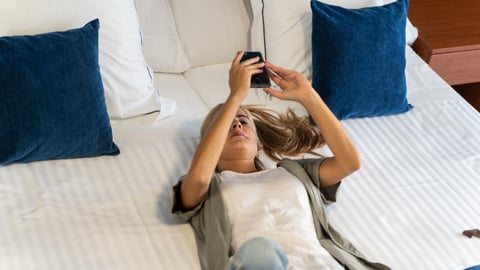 a woman lying on a bed