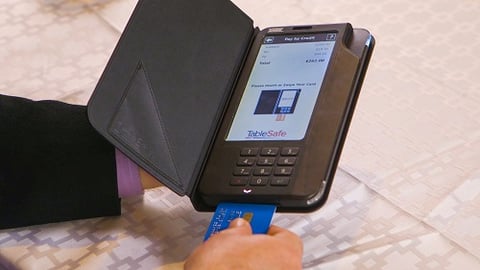 a laptop computer sitting on top of a suitcase