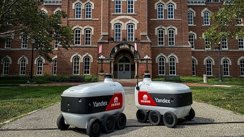 a car parked in front of a brick building