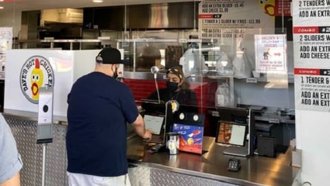 a man standing in front of a store