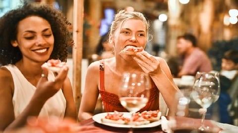 a person sitting at a table in a restaurant