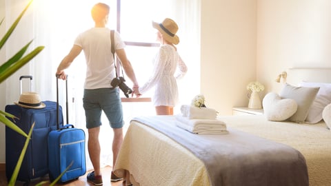 a person standing on top of a bed