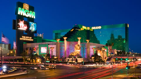 a lit up city at night with MGM Grand Las Vegas in the background