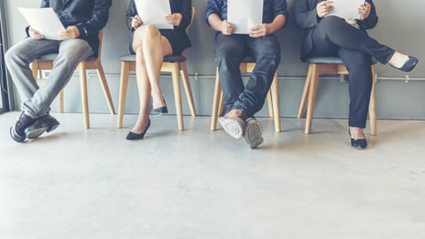 a group of people sitting in a chair