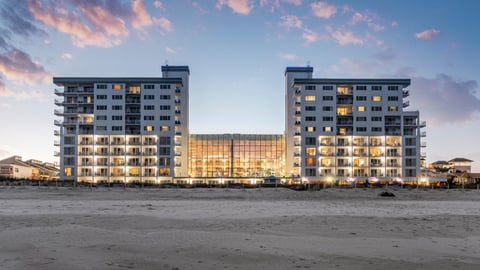 a beach with a city in the background