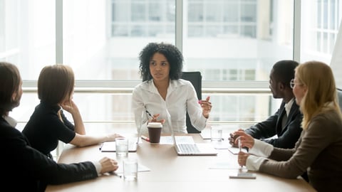 a group of people sitting at a table