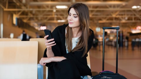 a woman holding a piece of luggage