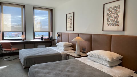 a bedroom with a large bed in a hotel room