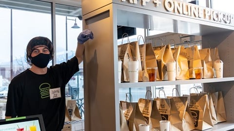 a man standing in front of a store