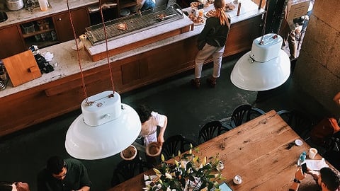 a group of people sitting at a table