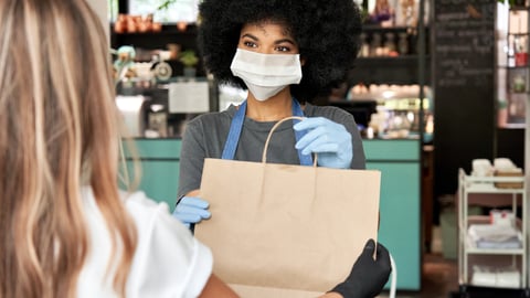 a woman standing in front of a store