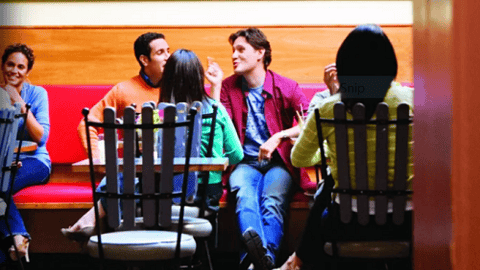 a group of people sitting at a table