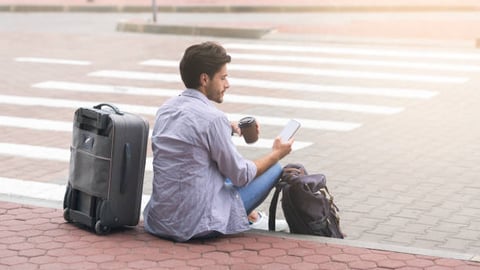 Man waiting for shuttle at airport