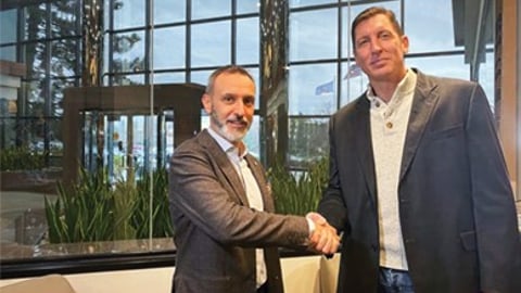 executives at telkonet and vda group shake hands