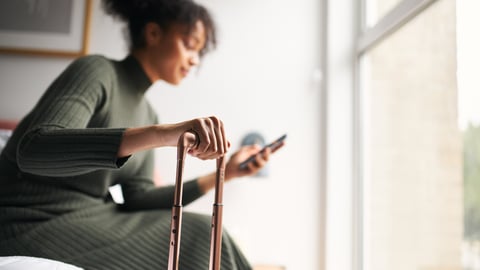 woman in hotel room on phone