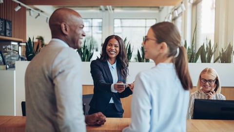 hotel concierge talking with guests