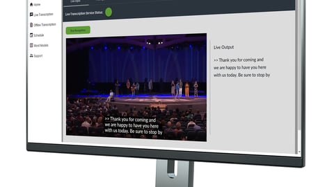 Live captions displayed on a computer monitor