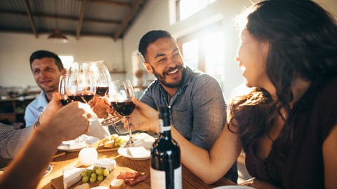 Restaurant diners laughing and eating