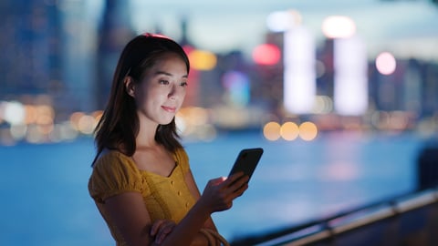 Woman using an app on her mobile phone