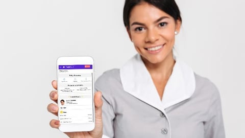 housekeeper holding up a mobile phone with housekeeping app