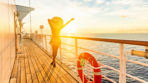 Sunset on a cruise ship with guest enjoying the ocean view