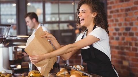 a person preparing food in a restaurant