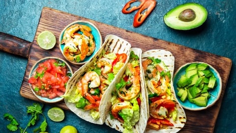 a bunch of food sitting on top of a wooden table