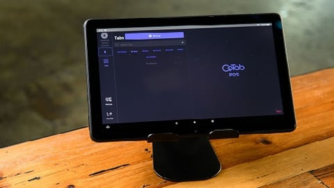 a desktop computer monitor sitting on top of a wooden table