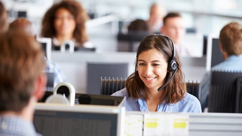 female call center agent taking a phone call 