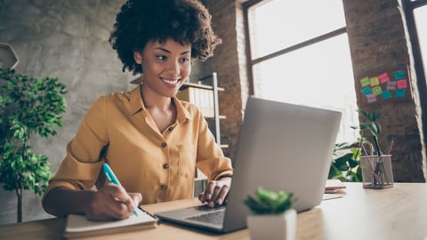 woman doing a training session on her laptop